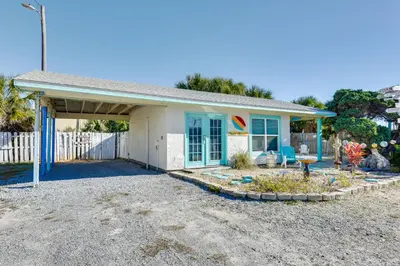 a small blue and white house with a fence at PCB Studio with Private Patio Steps to Beach! in Panama City Beach