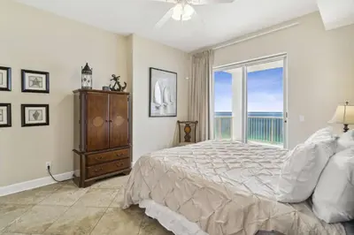 a bedroom with a bed and a large window at Ocean Ritz 2101 (4/4) in Panama City Beach