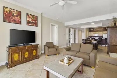 a living room with a flat screen tv and a couch at Ocean Ritz 2101 (4/4) in Panama City Beach
