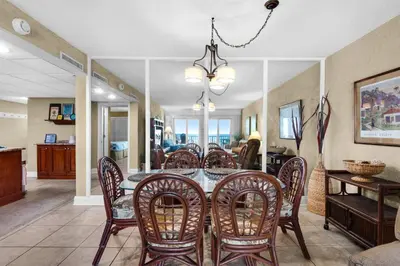 a dining room with a table and chairs at Sugar Beach C-17 (2/2) in Panama City Beach