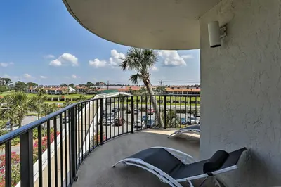 a chair on a balcony with a view of the ocean at Panama City Beach Condo with Balcony and Ocean Views in Panama City Beach