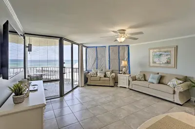a living room with a couch and a ceiling fan at Bright PCB Condo with Gulf Views and Beach Access! in Panama City Beach