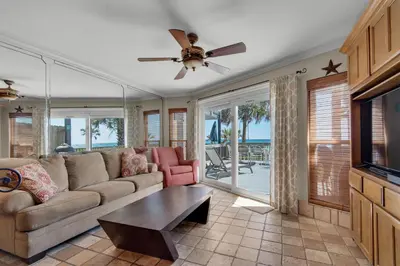 a living room with a couch and a table at Klaus House 3 in Panama City Beach