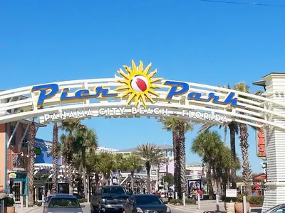 a sign for a park in a city with cars at Klaus House 3 in Panama City Beach