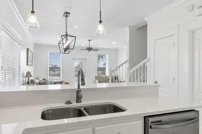 a kitchen with a sink and a counter top at Panama City Beach House - Sunnyside Up in Panama City Beach