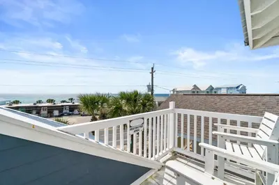 a view of the ocean from the balcony of a house at Panama City Beach House - Sunnyside Up in Panama City Beach