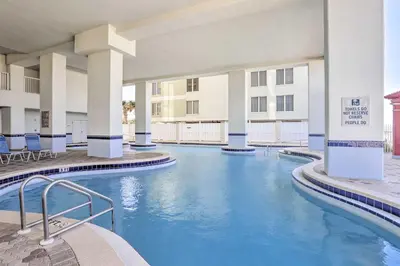 a pool in the courtyard of a hotel at Gulf Views! 9th-Floor Majestic Beach Resort Condo in Panama City Beach