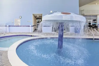 a fountain in the middle of a pool at Gulf Views! 9th-Floor Majestic Beach Resort Condo in Panama City Beach