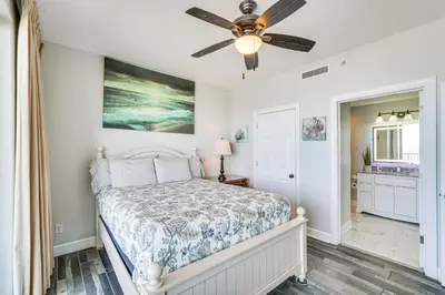 a bedroom with a bed and a ceiling fan at High-Rise PCB Condo with Oceanfront Views and Pool! in Panama City Beach