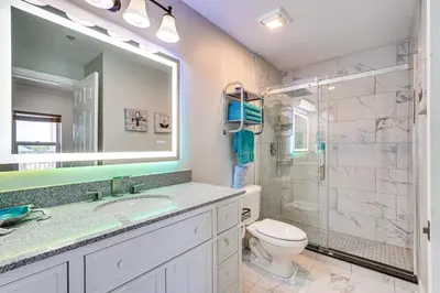a bathroom with a sink and a toilet and a shower at High-Rise PCB Condo with Oceanfront Views and Pool! in Panama City Beach