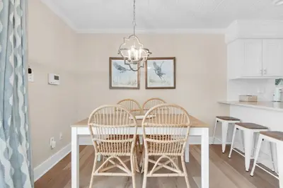 a kitchen and dining room with a table and chairs at Double Down in Santa Rosa Beach