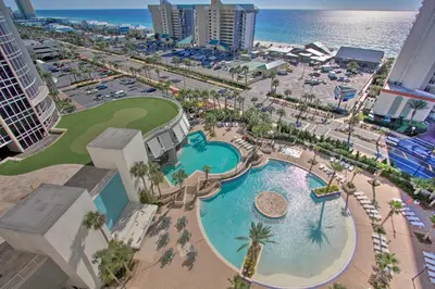 an aerial view of a pool at a resort at Comfy PCB Condo with View and Private Beach Access! in Panama City Beach