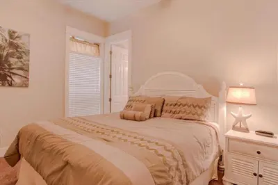 a bedroom with a large bed and a window at Amazing Place - 1232960 in Santa Rosa Beach