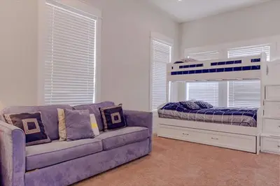a living room with a couch and a bed at Amazing Place - 1232960 in Santa Rosa Beach