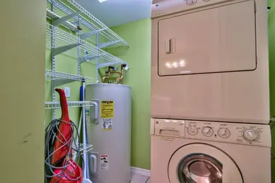 a laundry room with a washing machine and a washer at Pirate Cove Villa 117 - 825255 in Panama City Beach