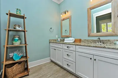 a bathroom with two sinks and a mirror at Seas The Day at Seacrest - 1228999 in Panama City Beach