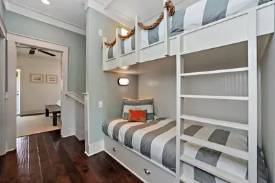 a kids room with a bunk bed and a staircase at Seas The Day at Seacrest - 1228999 in Panama City Beach