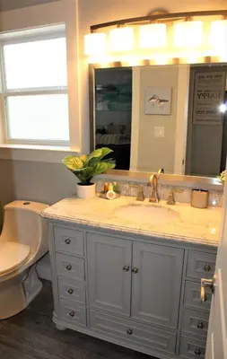 a bathroom with a sink and a toilet at Beach Beyond Belief House & private pool & free bikes & private beach in Rosemary Beach