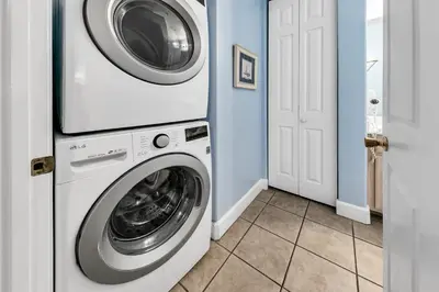 a washer and dryer in a laundry room at Ocean Ritz 1902 in Panama City Beach