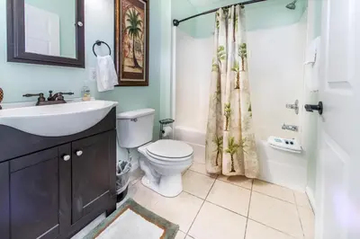 a bathroom with a sink and a toilet and a shower at Merrimac Resort #32 in Panama City Beach