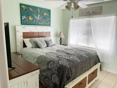 a bedroom with a bed and a ceiling fan at Merrimac Resort #32 in Panama City Beach