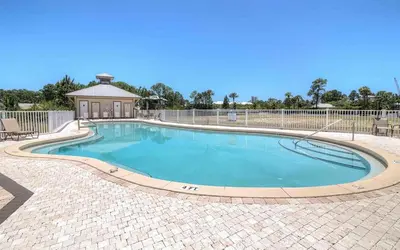a swimming pool with a gazebo in a yard at Churchill By The Sea 2308 in Santa Rosa Beach