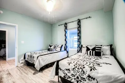 a bedroom with two beds and a window at Laketown Wharf 734 By Aneliya in Panama City Beach