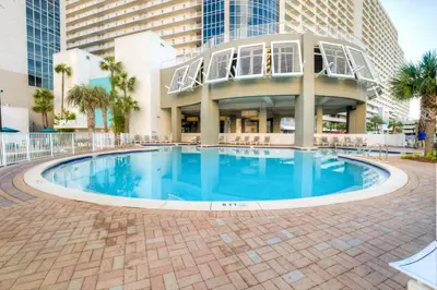 a large swimming pool in front of a building at Laketown Wharf 734 By Aneliya in Panama City Beach