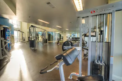 a gym with cardio equipment and a practition at Laketown Wharf 734 By Aneliya in Panama City Beach
