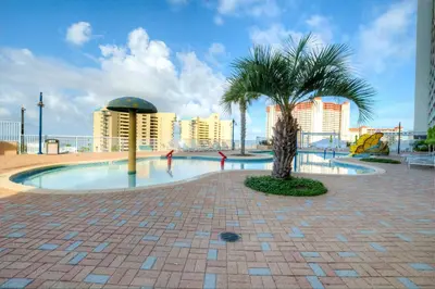 a palm tree in the middle of a playground at Laketown Wharf 734 By Aneliya in Panama City Beach