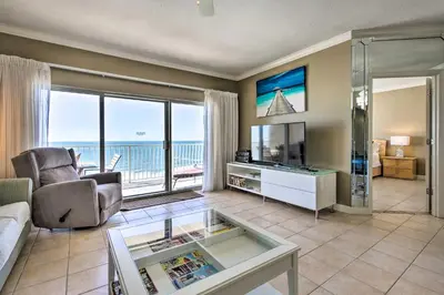 a living room with a view of the ocean at Gulf Views and Pool Access Coral Reef Resort Condo in Panama City Beach