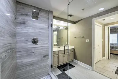 a bathroom with a shower and a sink at Gulf Views and Pool Access Coral Reef Resort Condo in Panama City Beach