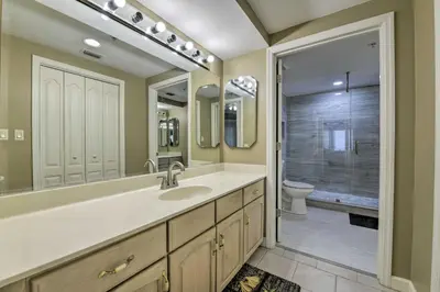 a bathroom with a sink and a toilet and a shower at Gulf Views and Pool Access Coral Reef Resort Condo in Panama City Beach