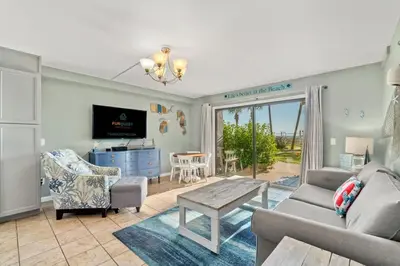 a living room with a couch and a table at The Summit 105 in Panama City Beach