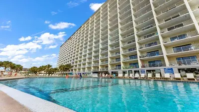 a swimming pool in front of a large building at The Summit 1116 in Panama City Beach