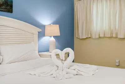 a bed with a heart made out of towels at The Summit 1116 in Panama City Beach