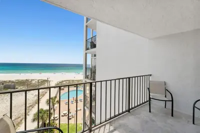 a balcony with a view of the beach and the ocean at Moondrifter 608 in Panama City Beach