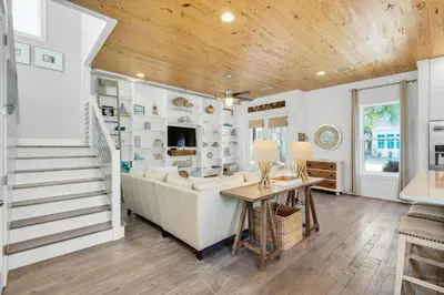 a living room with a couch and a table at Aqua Blue in Inlet Beach