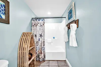 a bathroom with a shower and a toilet at Shores of Panama 1003 in Panama City Beach