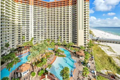 an aerial view of a resort with a pool and the beach at Shores of Panama 1003 in Panama City Beach