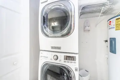 two washing machines are stacked on top of each other at Tidewater 502 in Panama City Beach