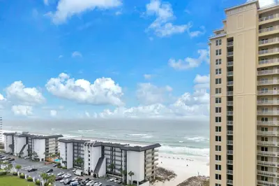 a view of the beach from the balcony of a building at Grand Panama 2-705 in Panama City Beach