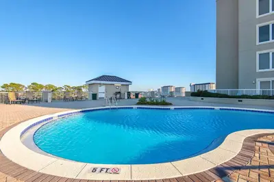 a large swimming pool in front of a building at Grand Panama 2-705 in Panama City Beach