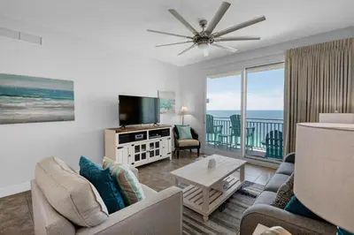 a living room with a view of the ocean at Sterling Breeze 2006 in Panama City Beach