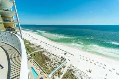 a view of the beach from the balcony of a hotel at Ocean Villa 1406 in Panama City Beach
