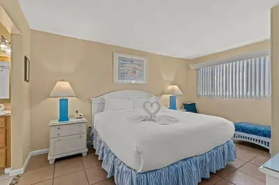 a bedroom with a large white bed in a room at The Summit 506 in Panama City Beach