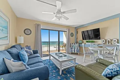a living room with a couch and a table at The Summit 506 in Panama City Beach