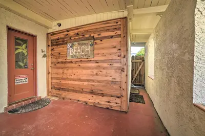 a wooden garage door with a sign on it at Walk to Beach PCB Retreat with Private Pool! in Panama City Beach