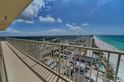 a view of the beach from the balcony of a resort at Calming Beachfront Condo with Oversized Balcony Facing the Gulf - Unit 2101 in Panama City Beach