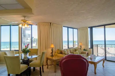 a living room with a view of the ocean at Sunbird 0208W 'Surfside Sandcastle' in Panama City Beach